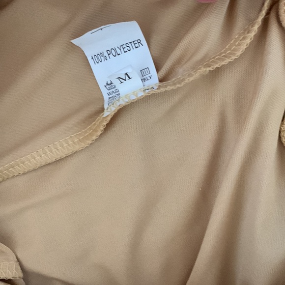 Golden Skorts. Slits on sides. Size Medium. 100% Polyester. Made in China. - Picture 3 of 3